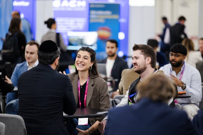 Attendees meeting at a table