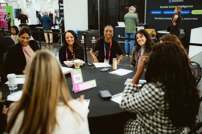 Attendees at a table discussion
