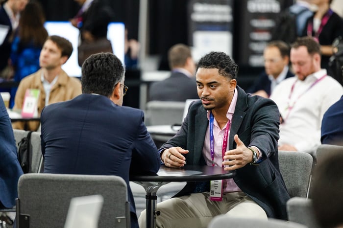 Two attendees in conversation